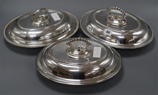 A pair of plated entree dishes and cover, and one other